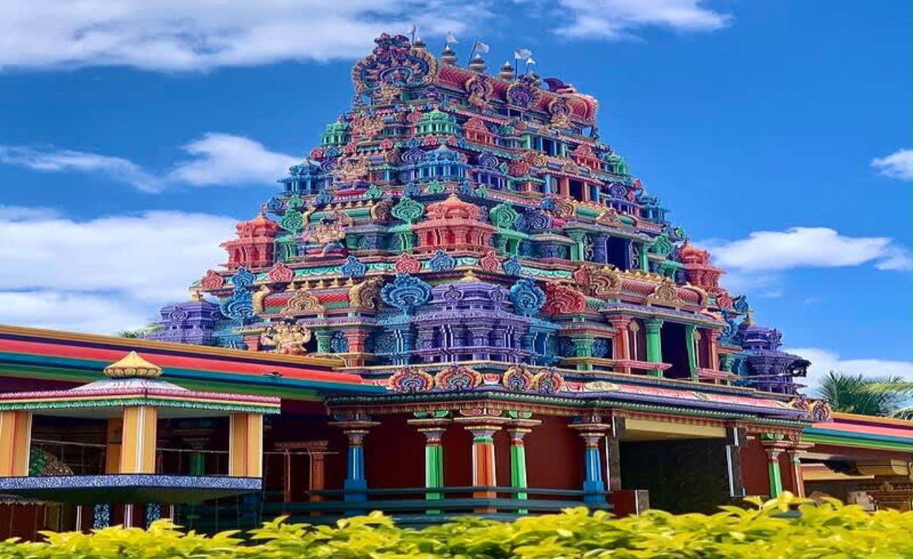 The brightly painted gopuram of Sri Siva Subramaniya temple in Nadi against a blue sky